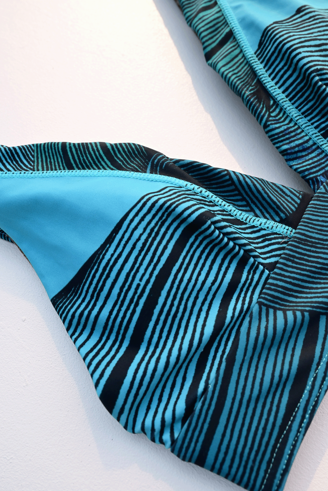 Black & Blue two-piece bikini closeup photograph