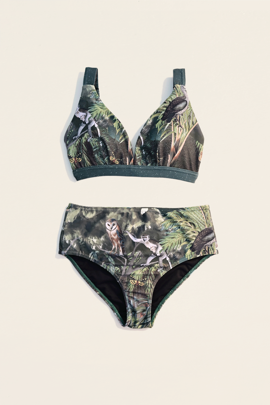 moody flora & fauna design two-piece bikini flat-lay photograph