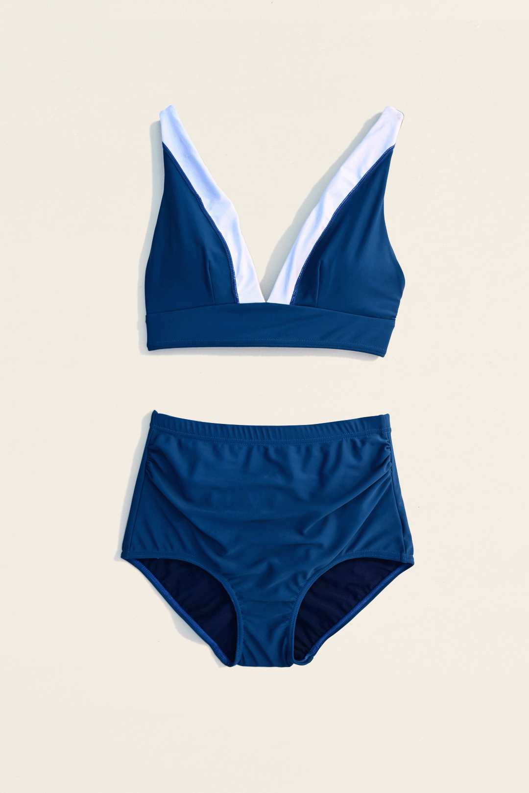 Navy blue & white two-piece bikini flat-lay photograph