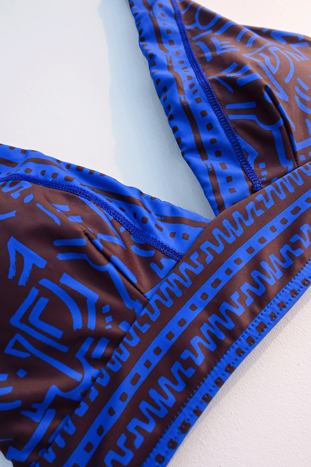 Electric blue & brown two-piece costume closeup photograph