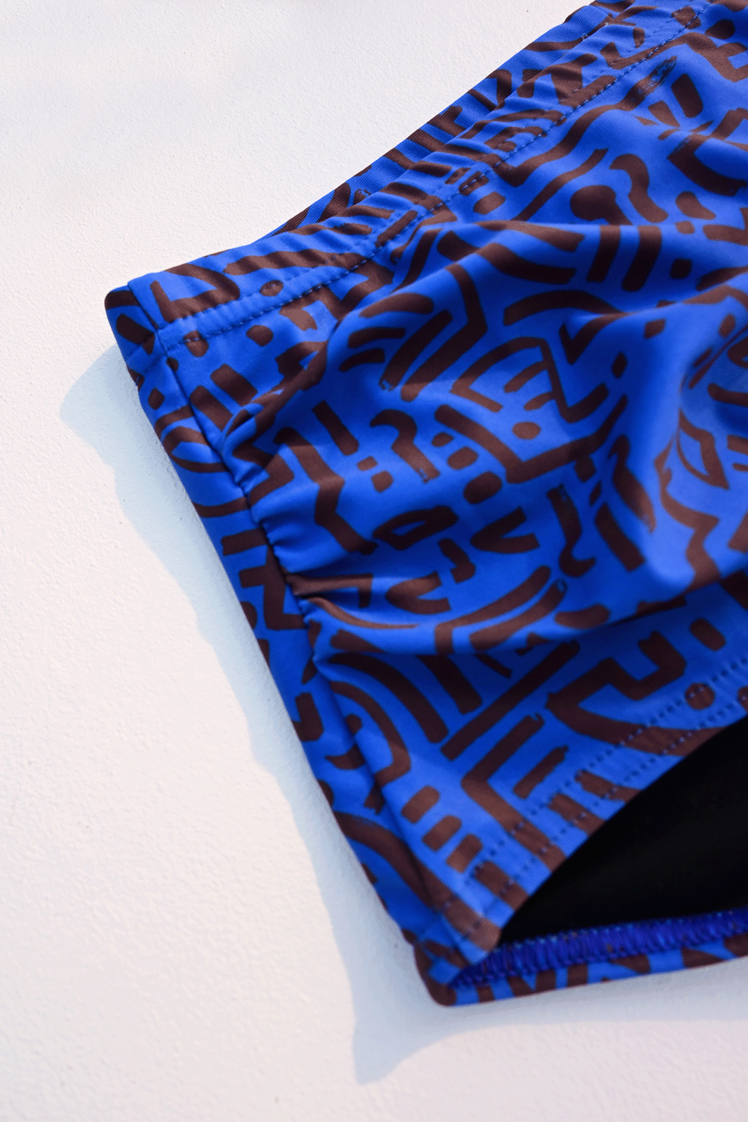 Electric blue & brown two-piece costume closeup photograph