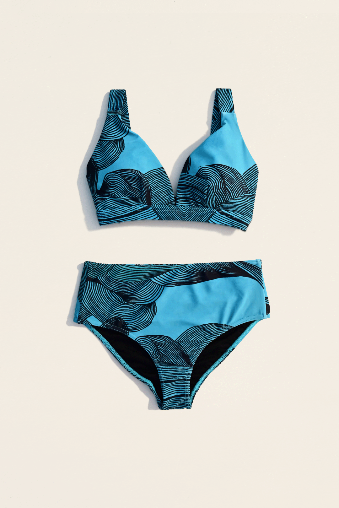 Black & Blue two-piece bikini flat-lay photograph