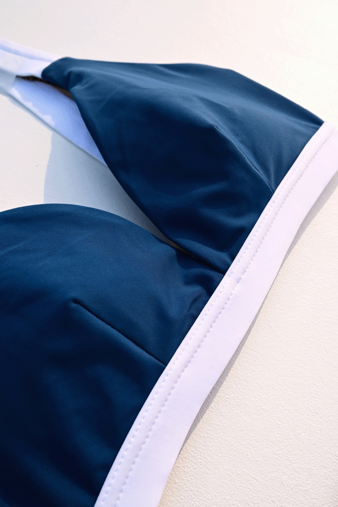 Navy blue & white two-piece bikini closeup photograph