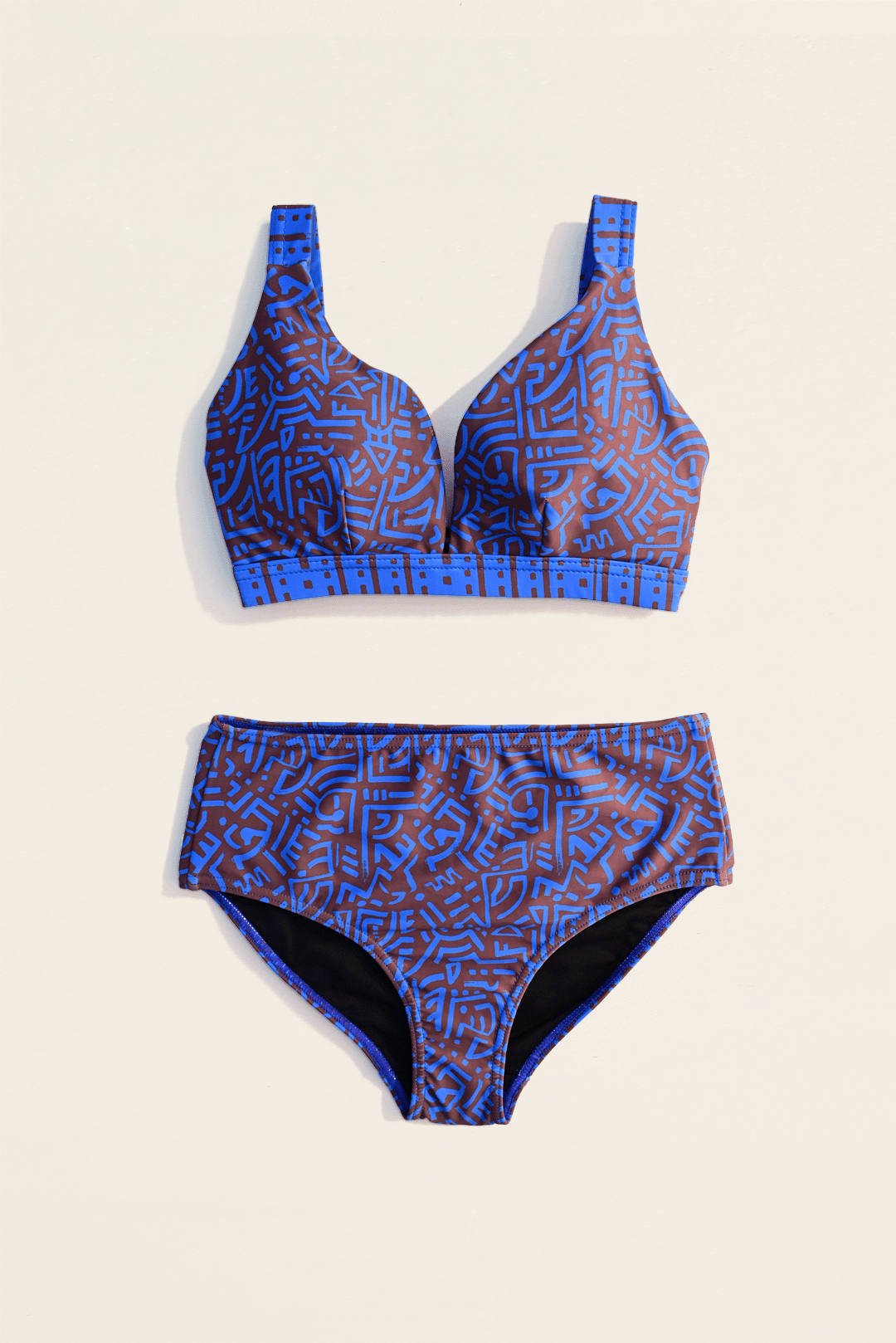 Electric blue & brown two-piece bikini flat-lay photograph