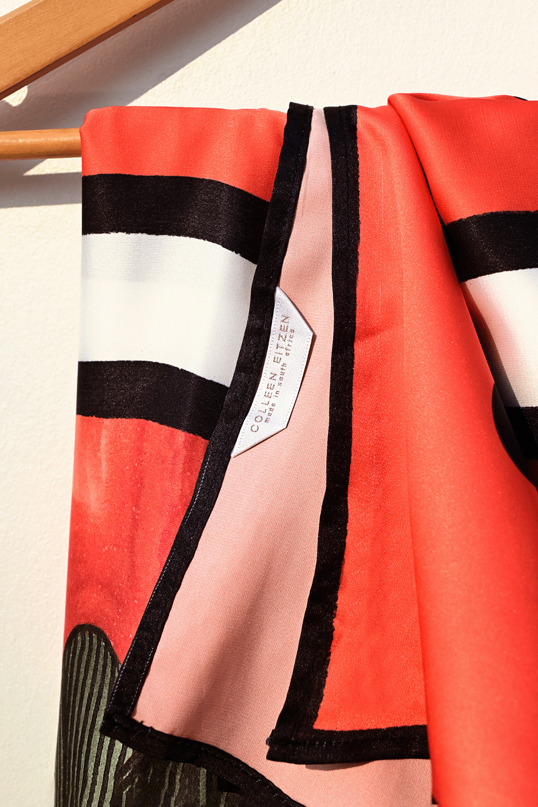 orange, black & forest green pareo closeup photograph