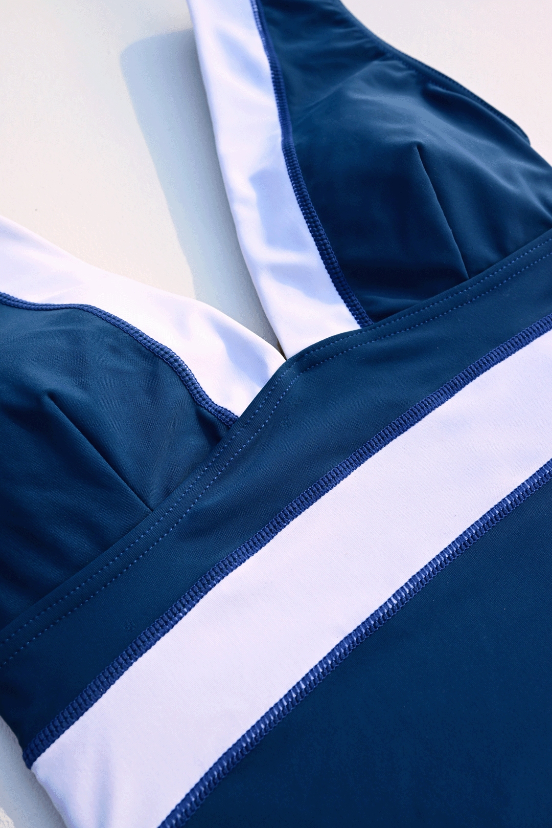 Navy blue & white one-piece costume closeup photograph