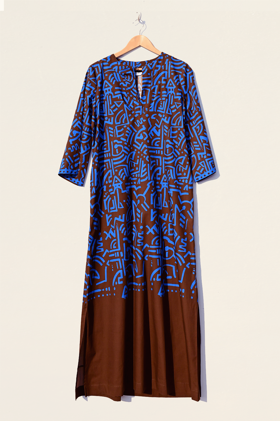 Electric blue & brown kaftan hanging photograph