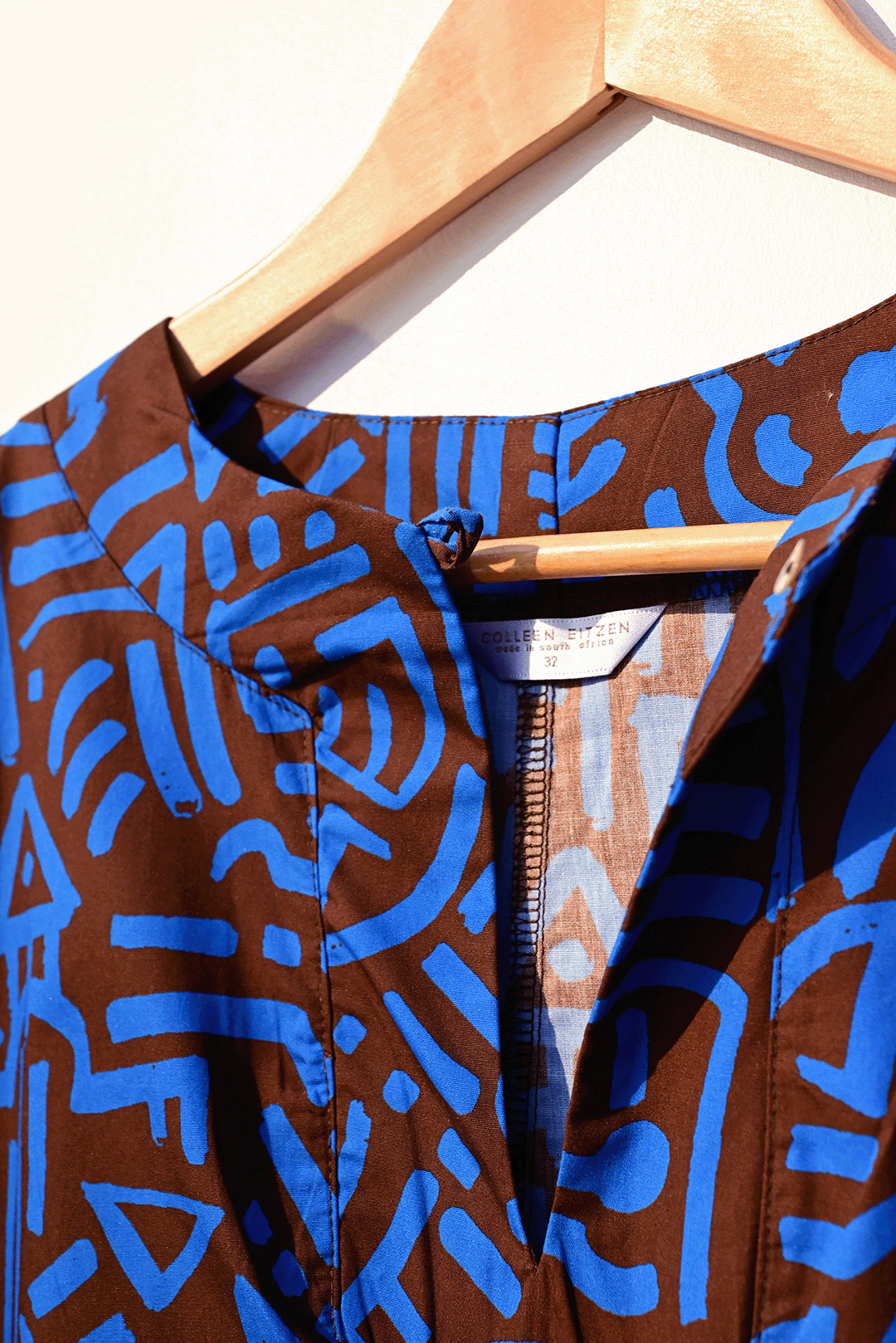 Electric blue & brown kaftan closeup photograph