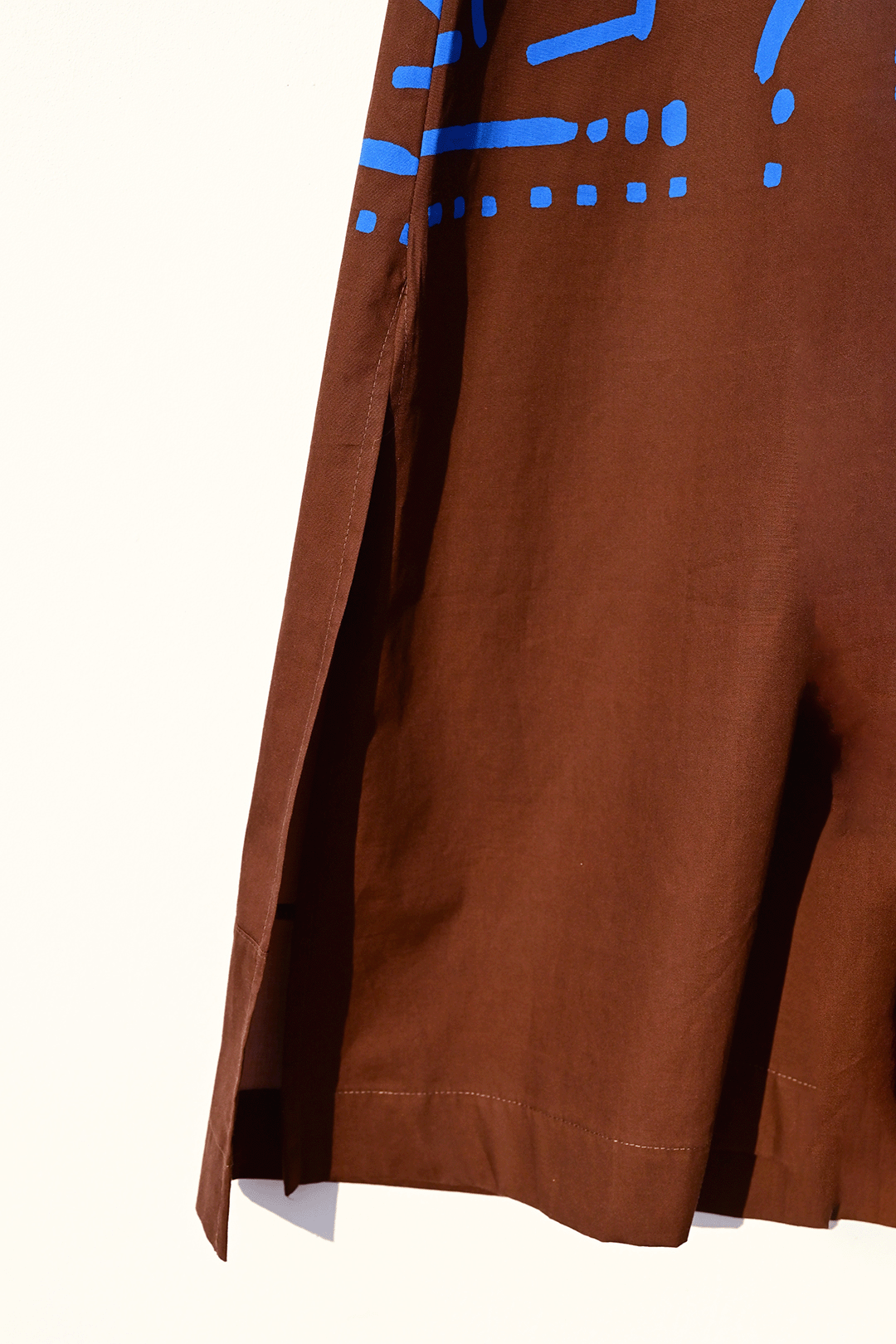 Electric blue & brown kaftan closeup photograph