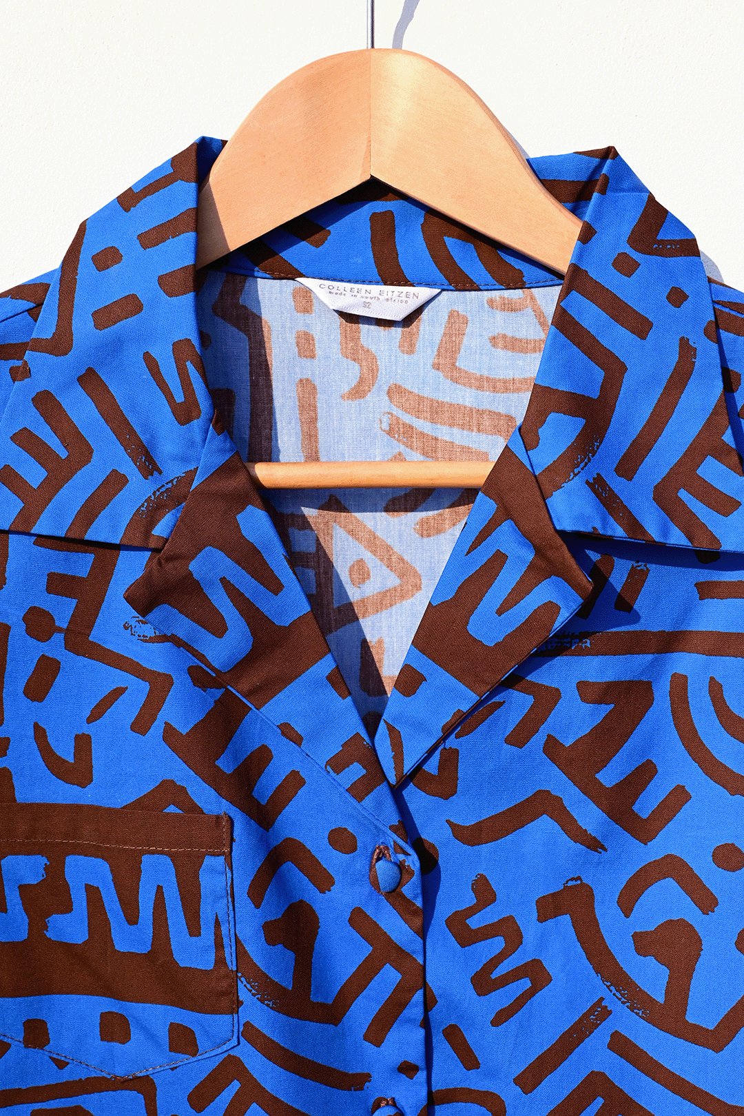 Electric blue & brown shirt collar photograph