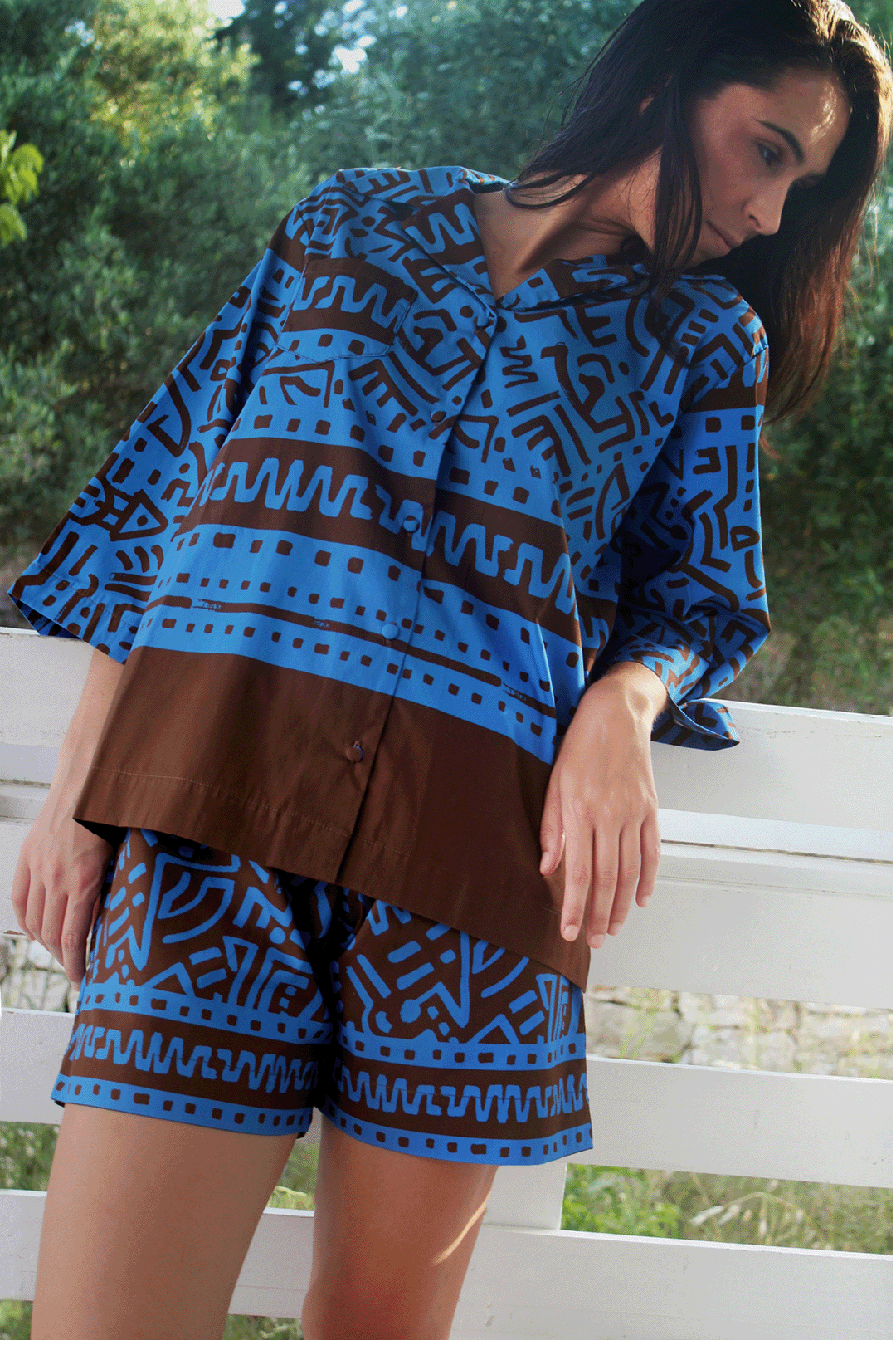 Electric blue & brown shirt & pants set lifestyle photograph